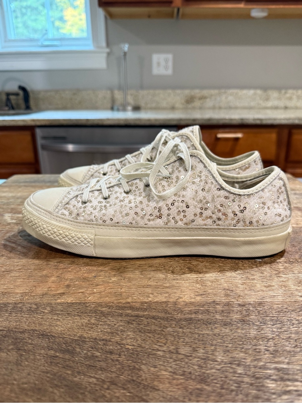 Converse Chuck Taylor All Star low-top sneakers featuring cream-colored sequins